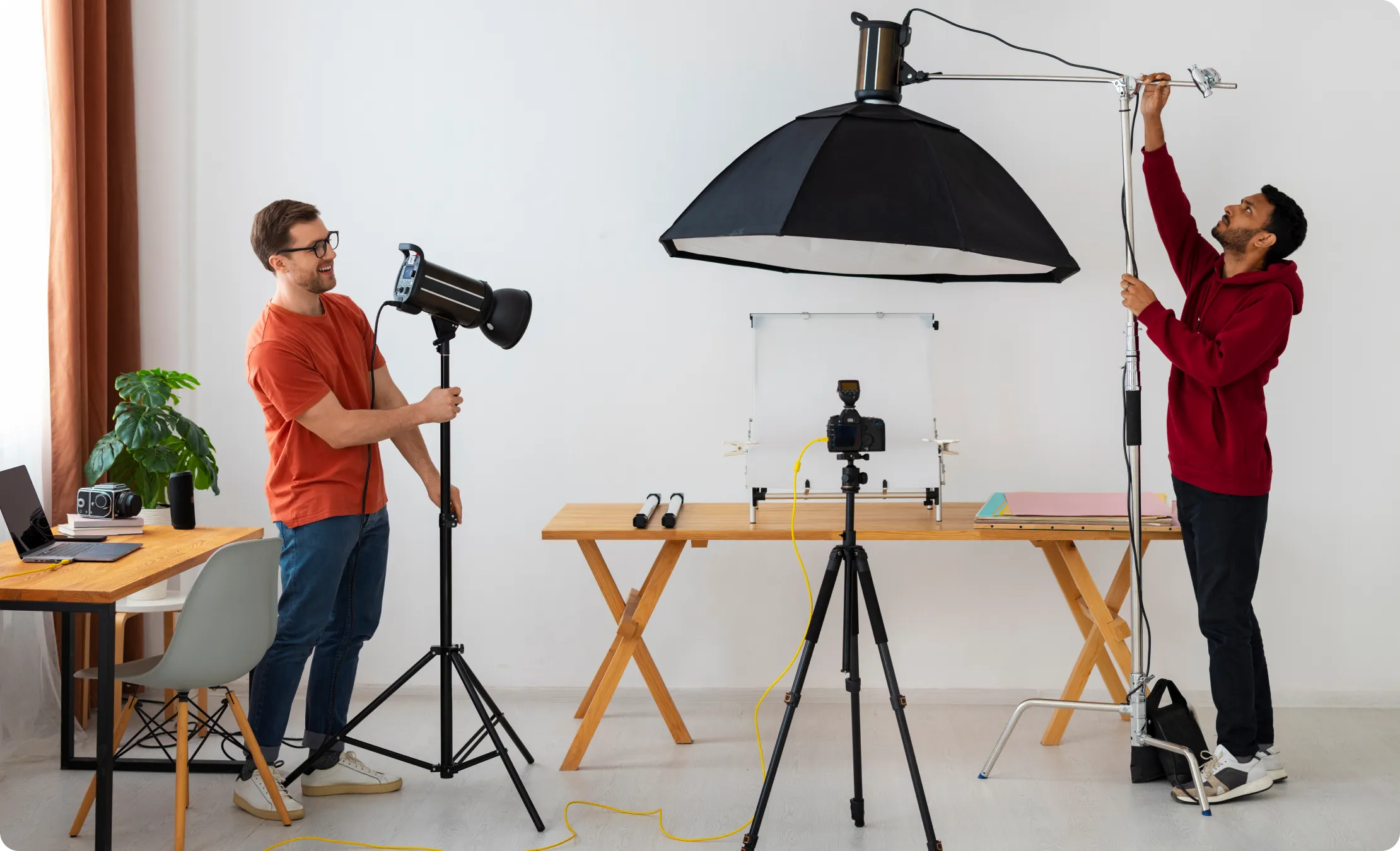 Two man setting up all the cameras and other equipments