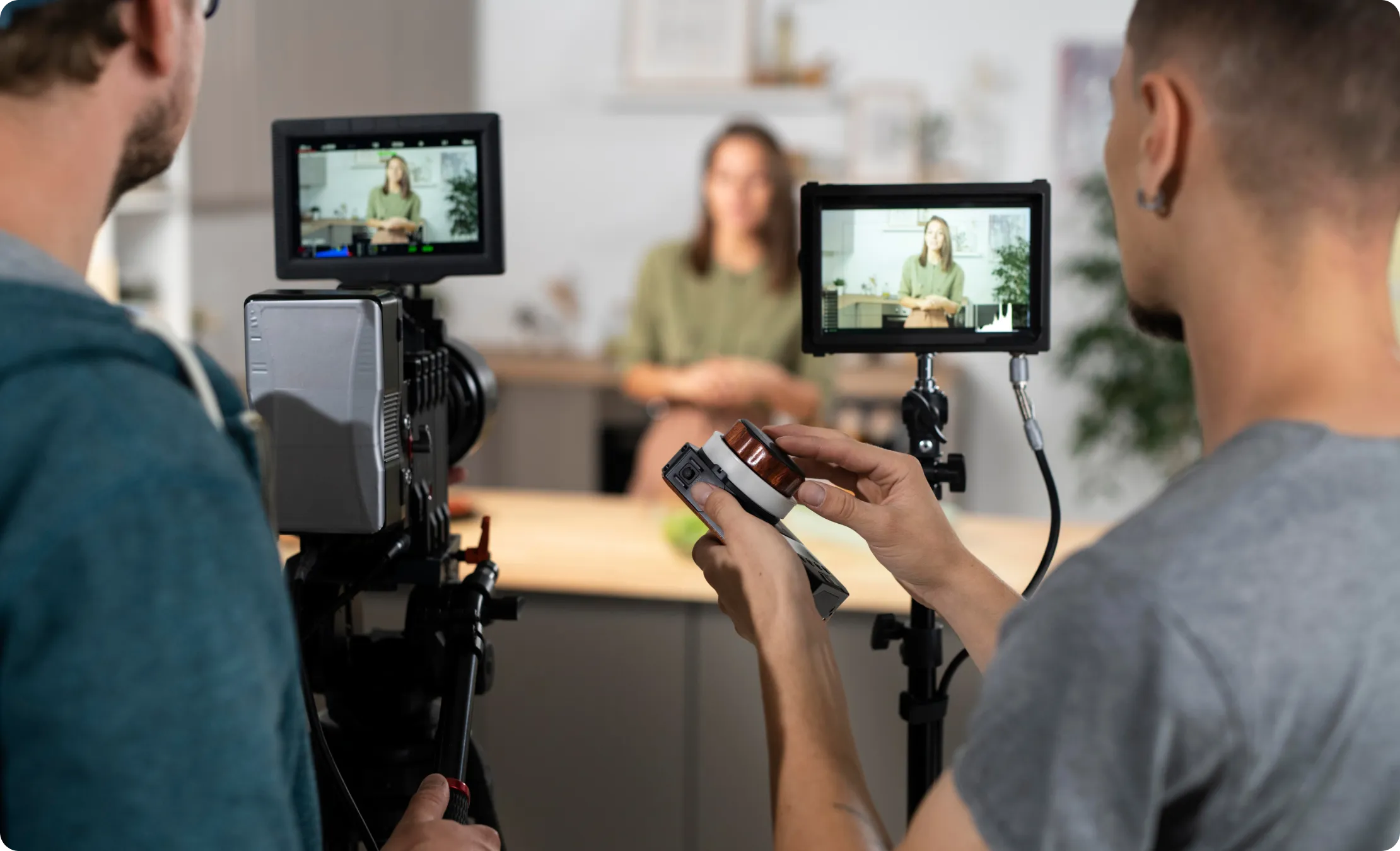 A woman taking video with two camera