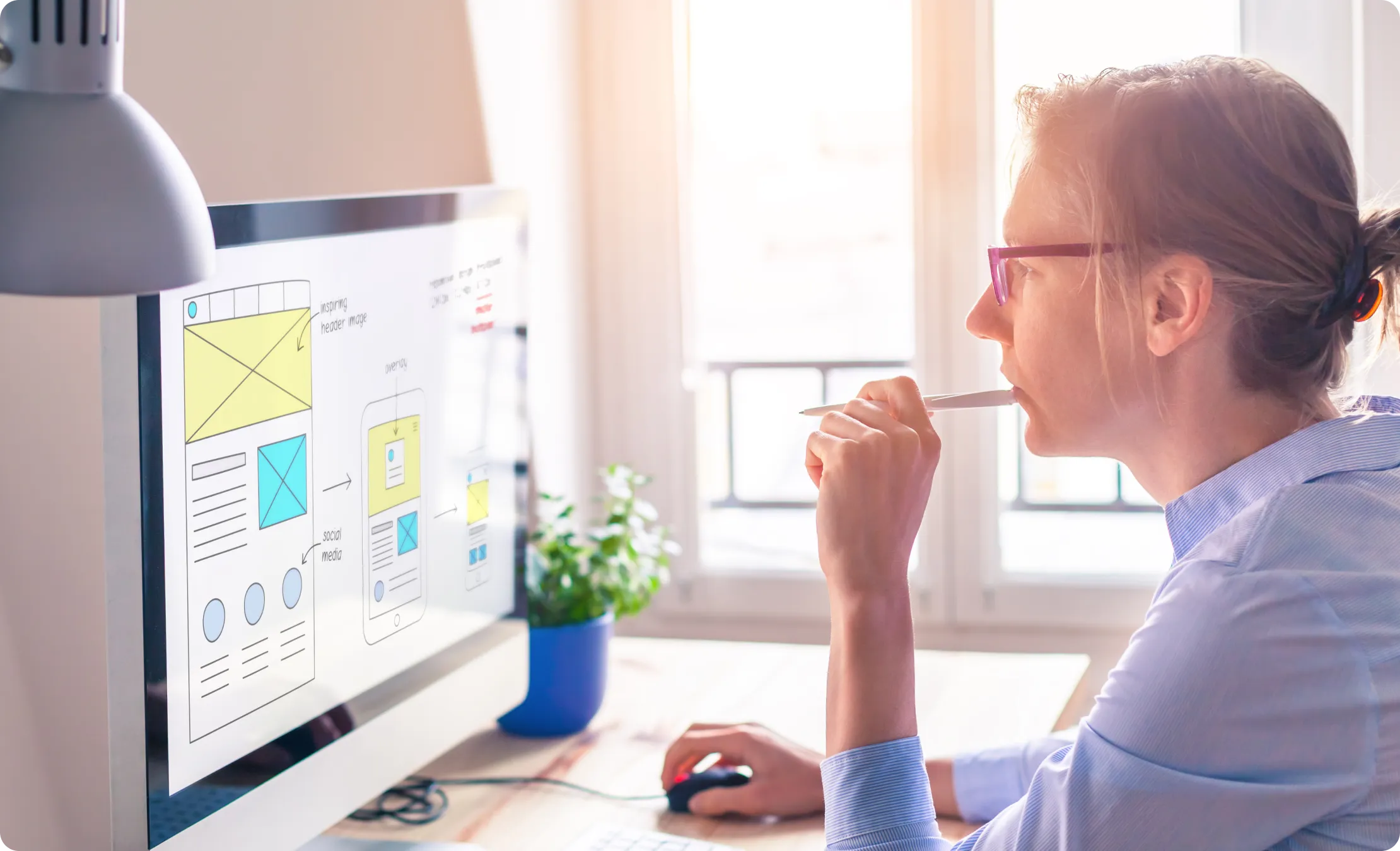 A woman in front of her computer