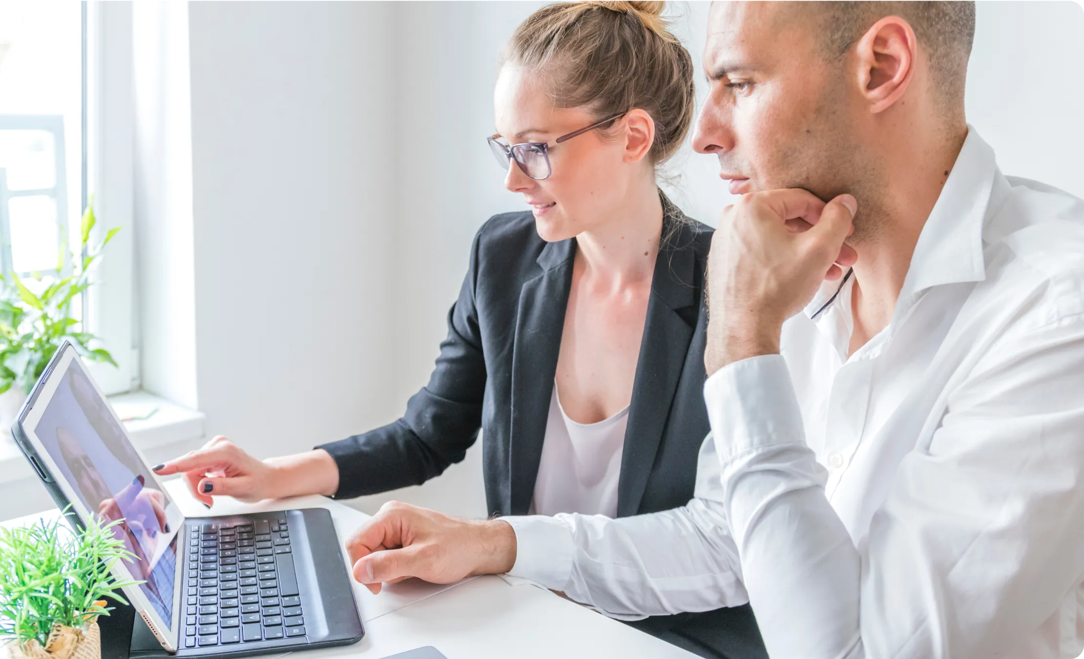 A man and woman with laptop