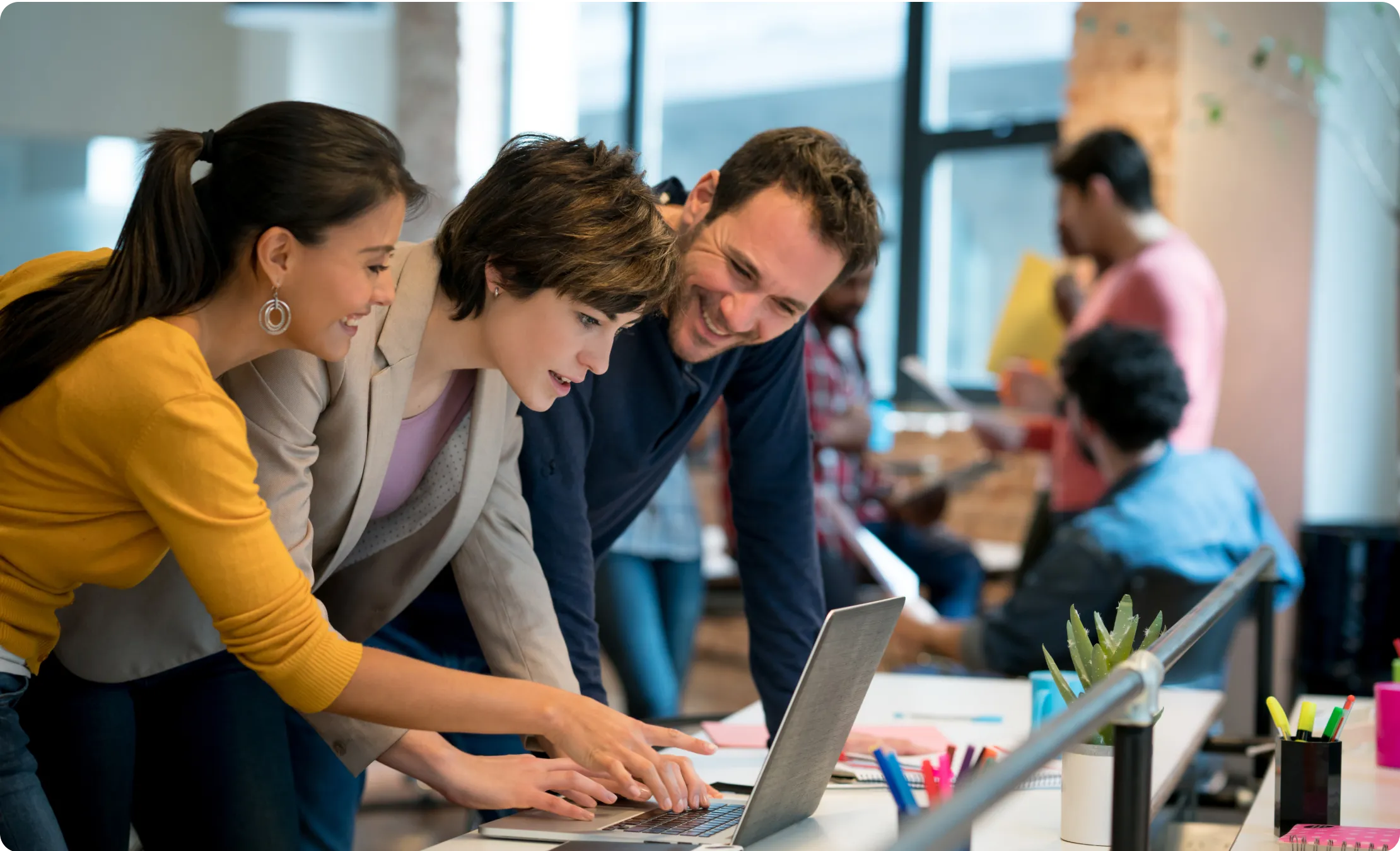 Three person working with laptop