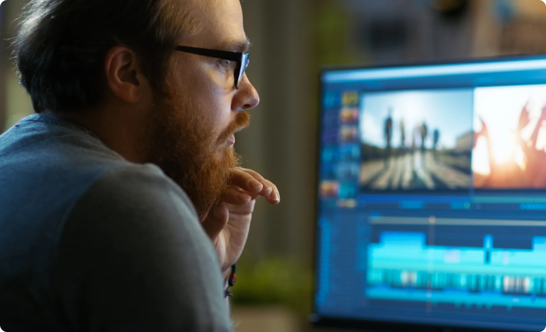 A man with eyeglass and computer