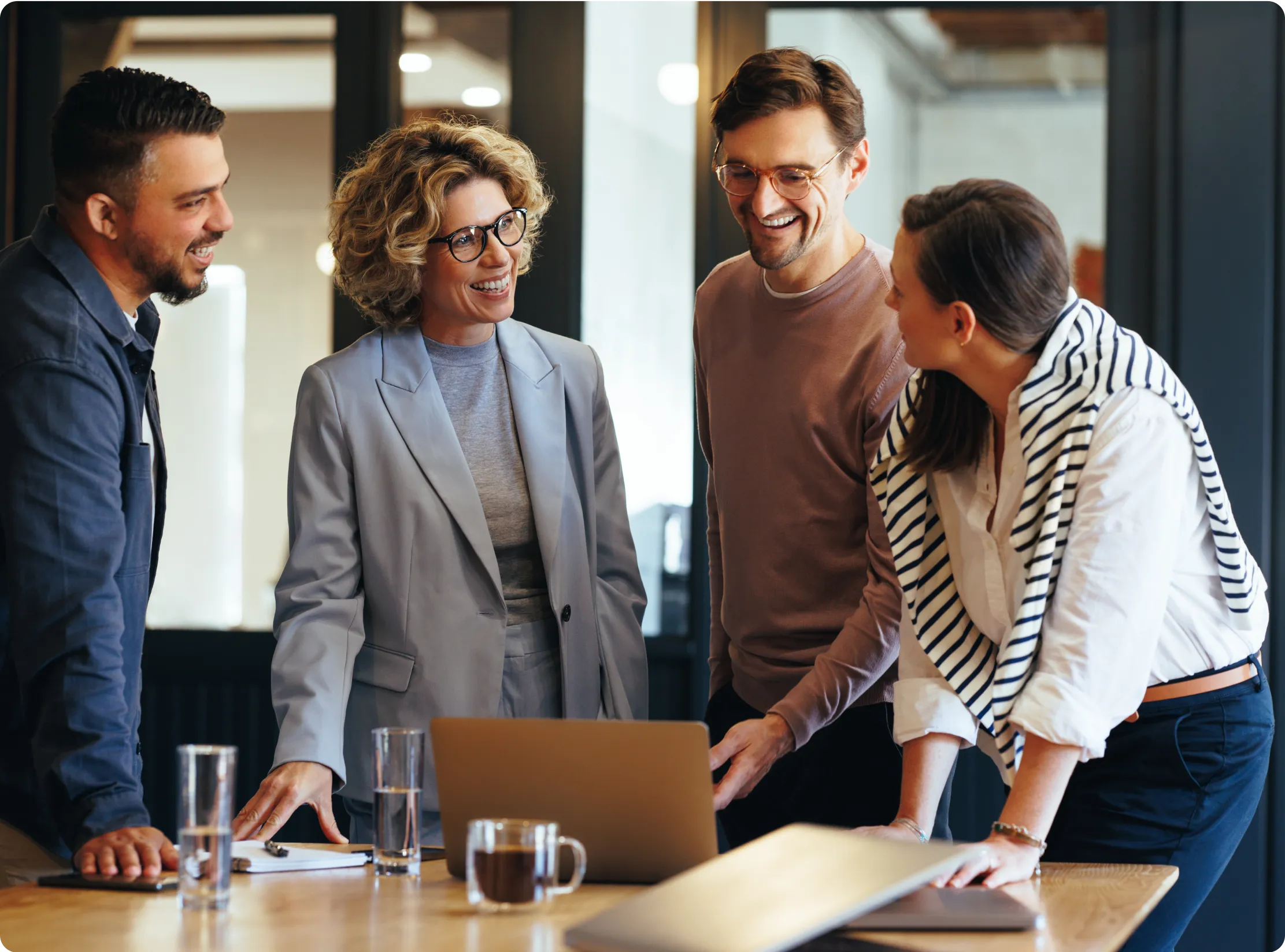 Group of four people with laptop