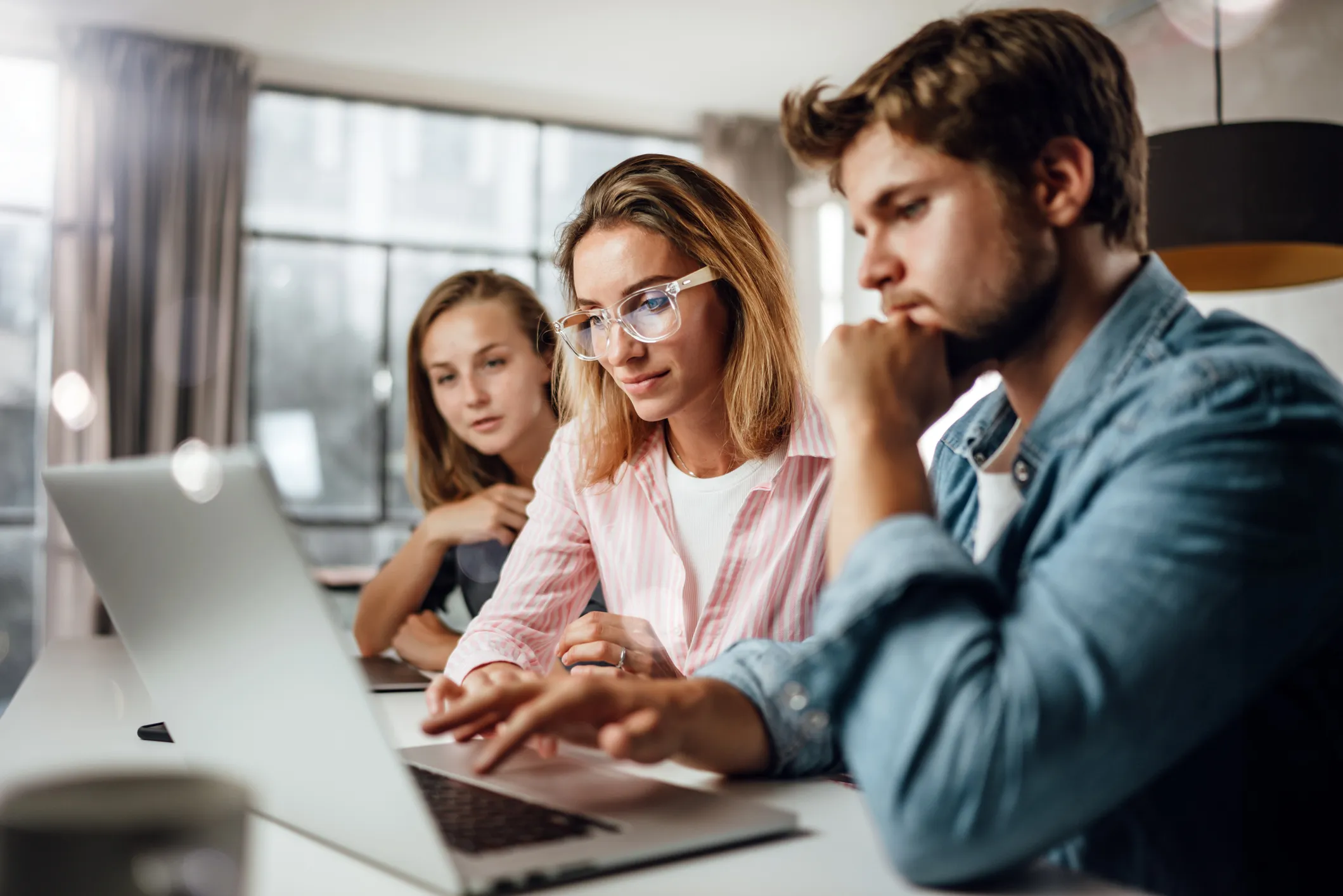 Three person with laptop