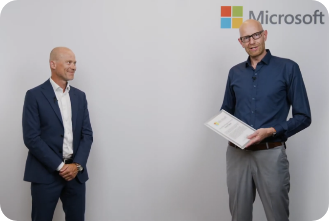 Two man standing with Microsoft